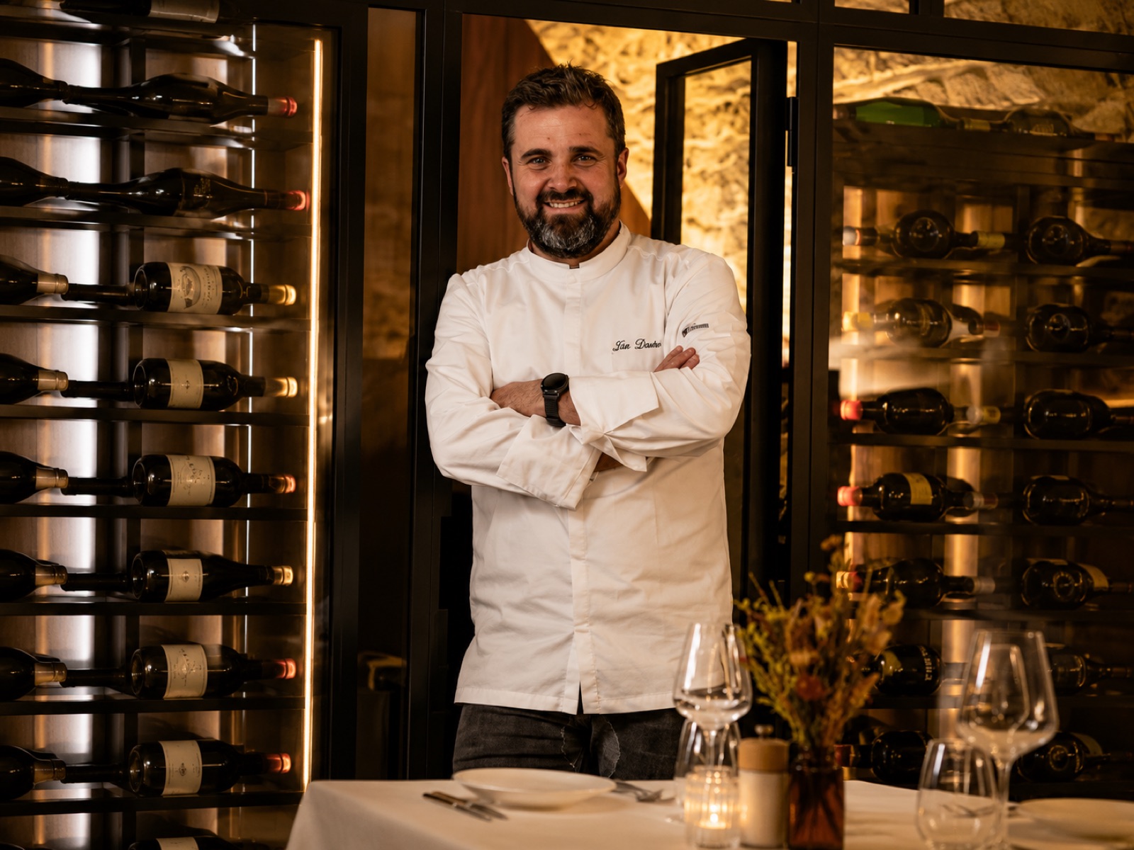 Chef at the wine cabinet
